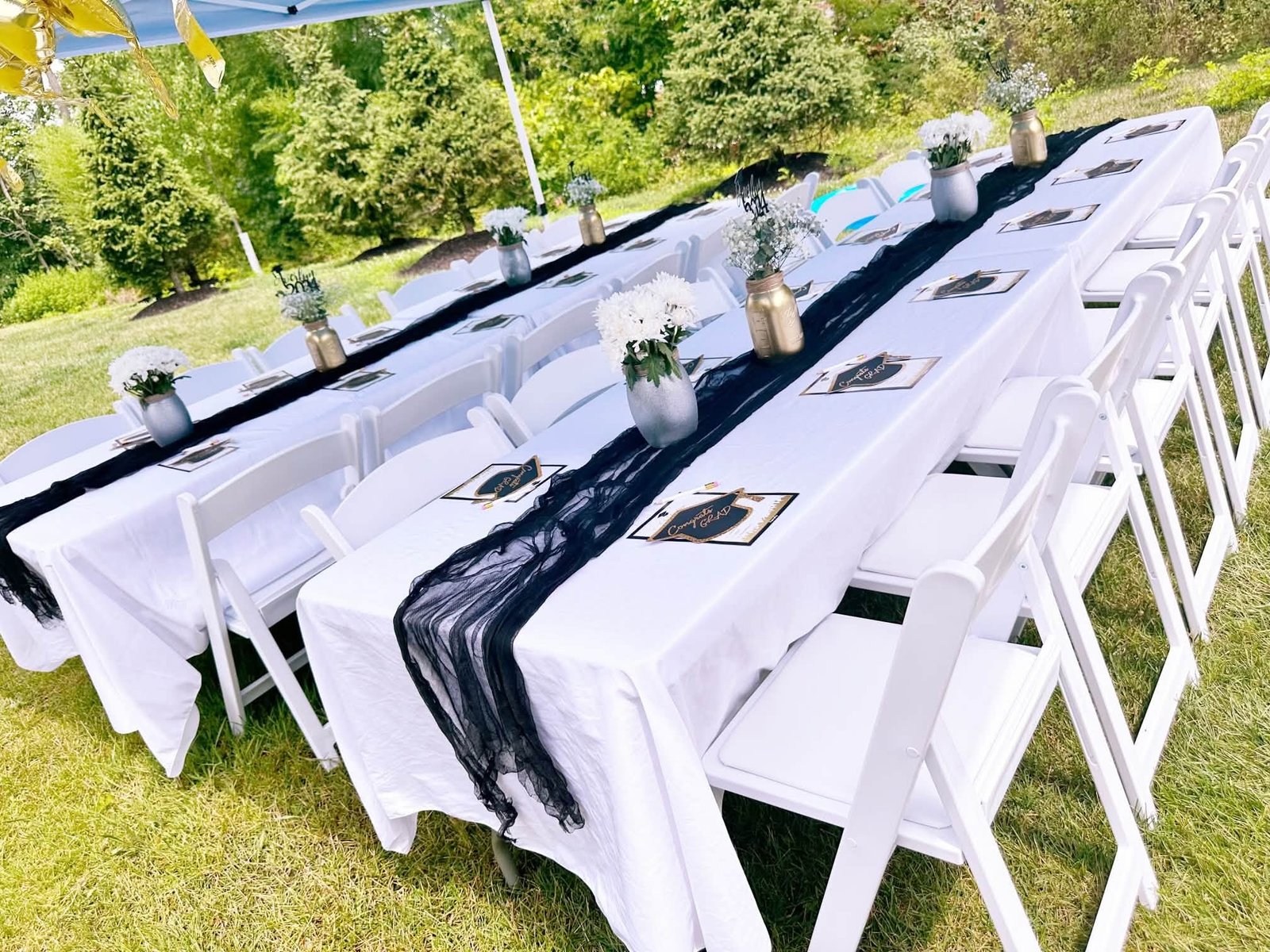 White folding chair rental setup